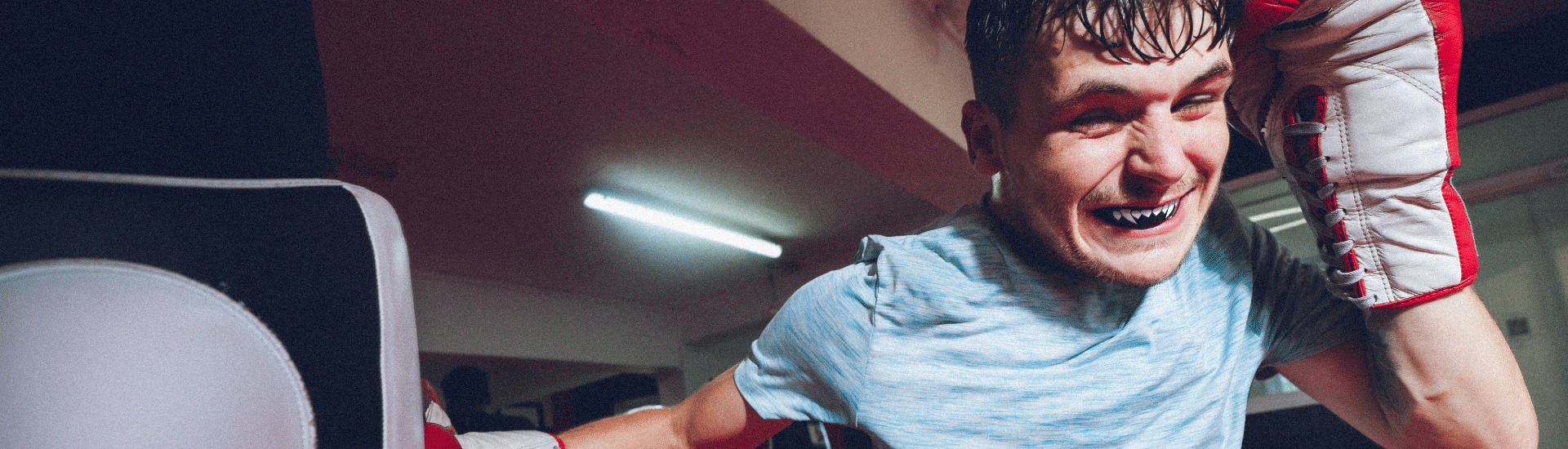 Boxer wearing SAFEJAWZ Black Fangz mouthguard