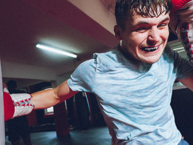 Boxer wearing SAFEJAWZ Black Fangz mouthguard